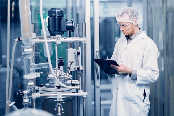 worker in factory with tablet