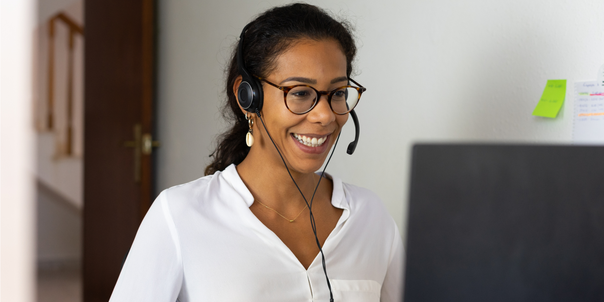 Woman on headset smiling